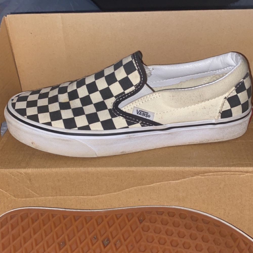 Checkered black and white slip on vans
